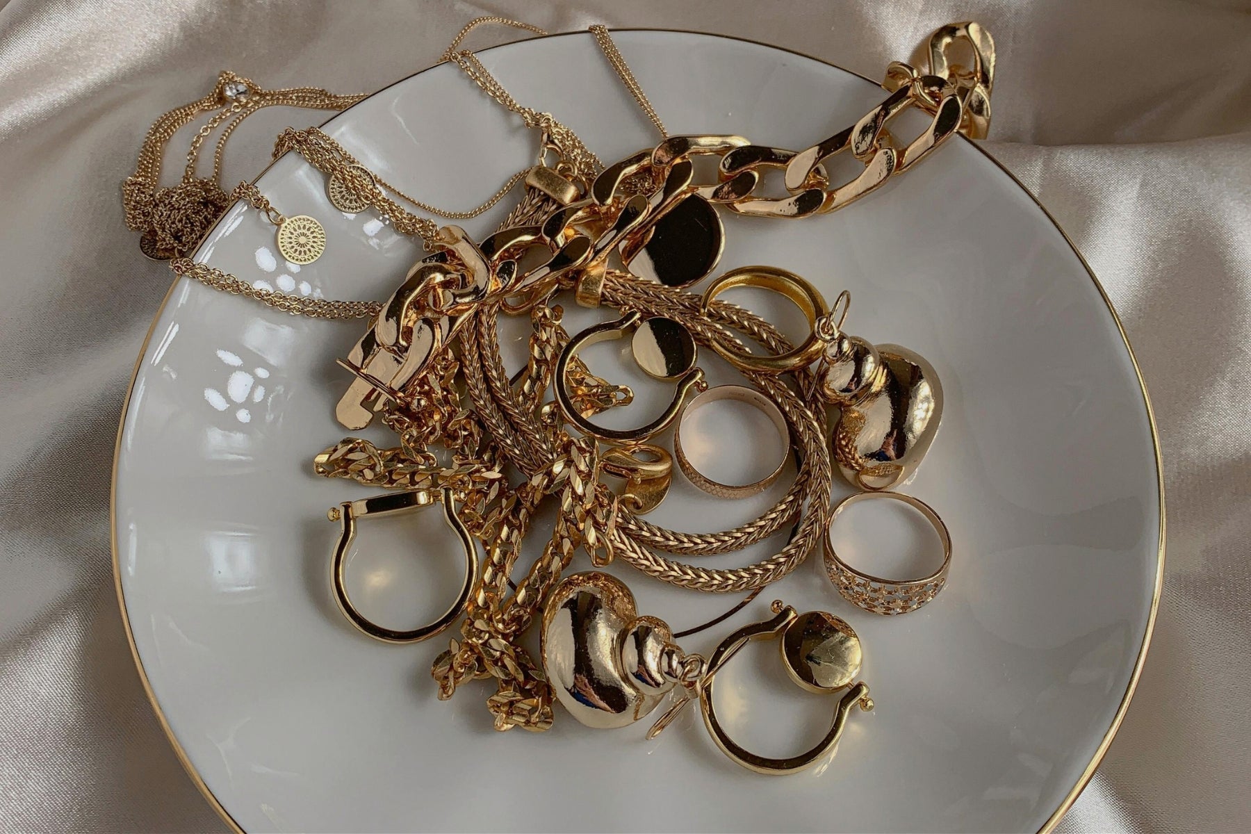 Gold Jewelry on a white plate